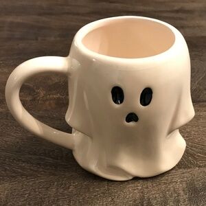 Left-handed white ceramic figural ghost mug